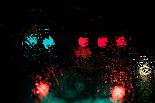 night red and blue lights reflecting through body of water at nighttime alpharetta